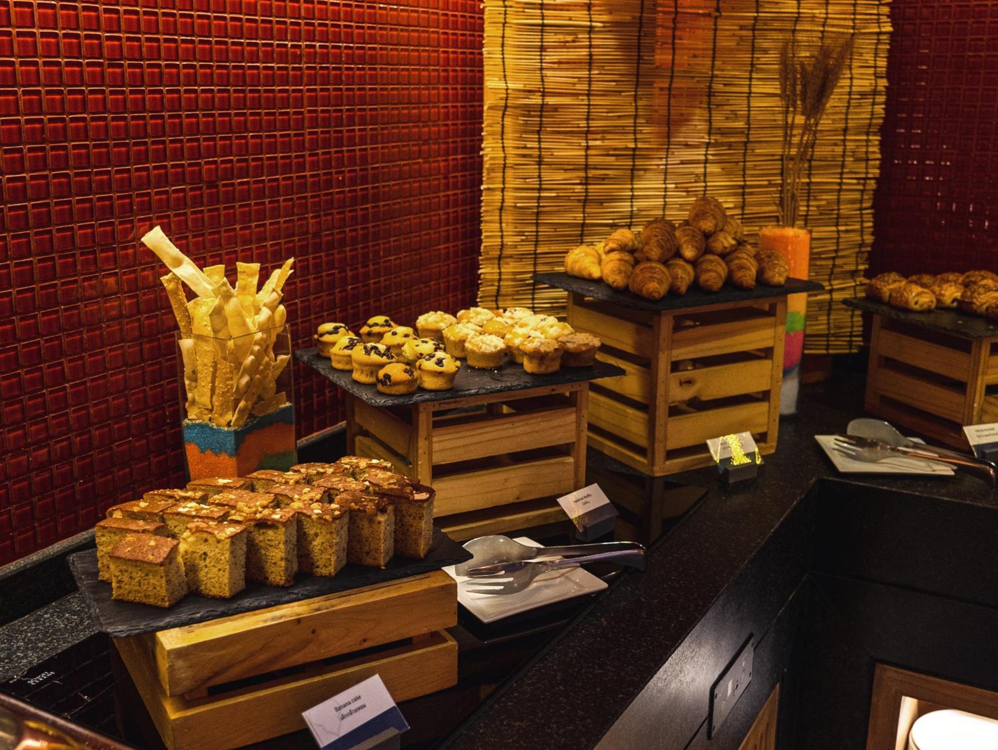 Amari Hua Hin Hotel Exterior photo A selection of pastries at a buffet